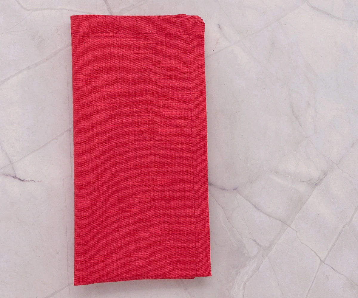 Reusable maroon cotton napkins stacked neatly, perfect for home or event use. Reusable maroon cotton napkins stacked neatly, perfect for home or event use.
