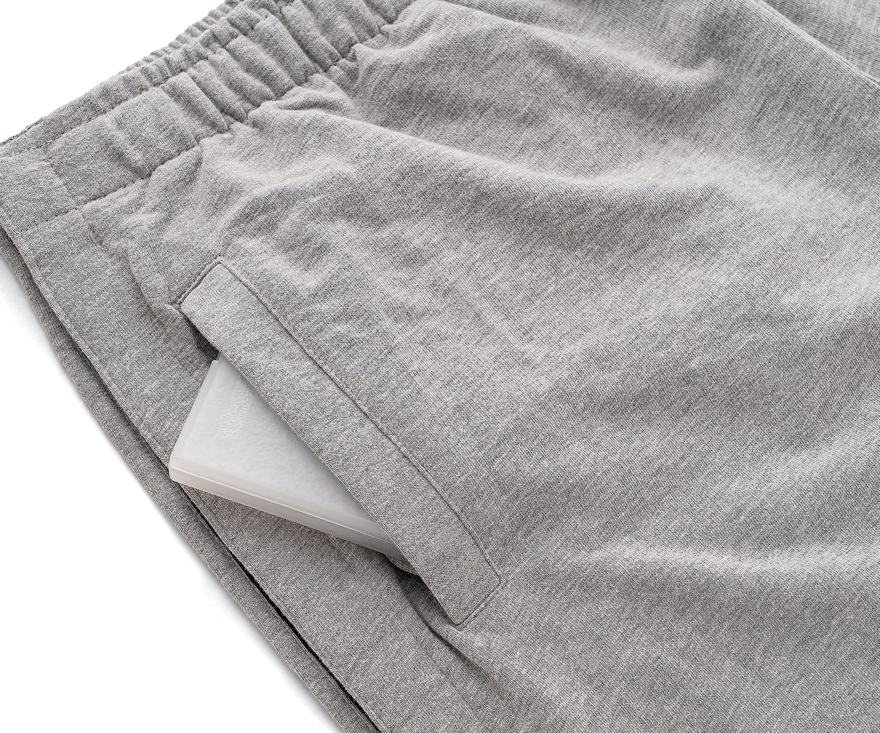 Gray shorts with a white interior lining on a light gray background Gray shorts with a white interior lining on a light gray background