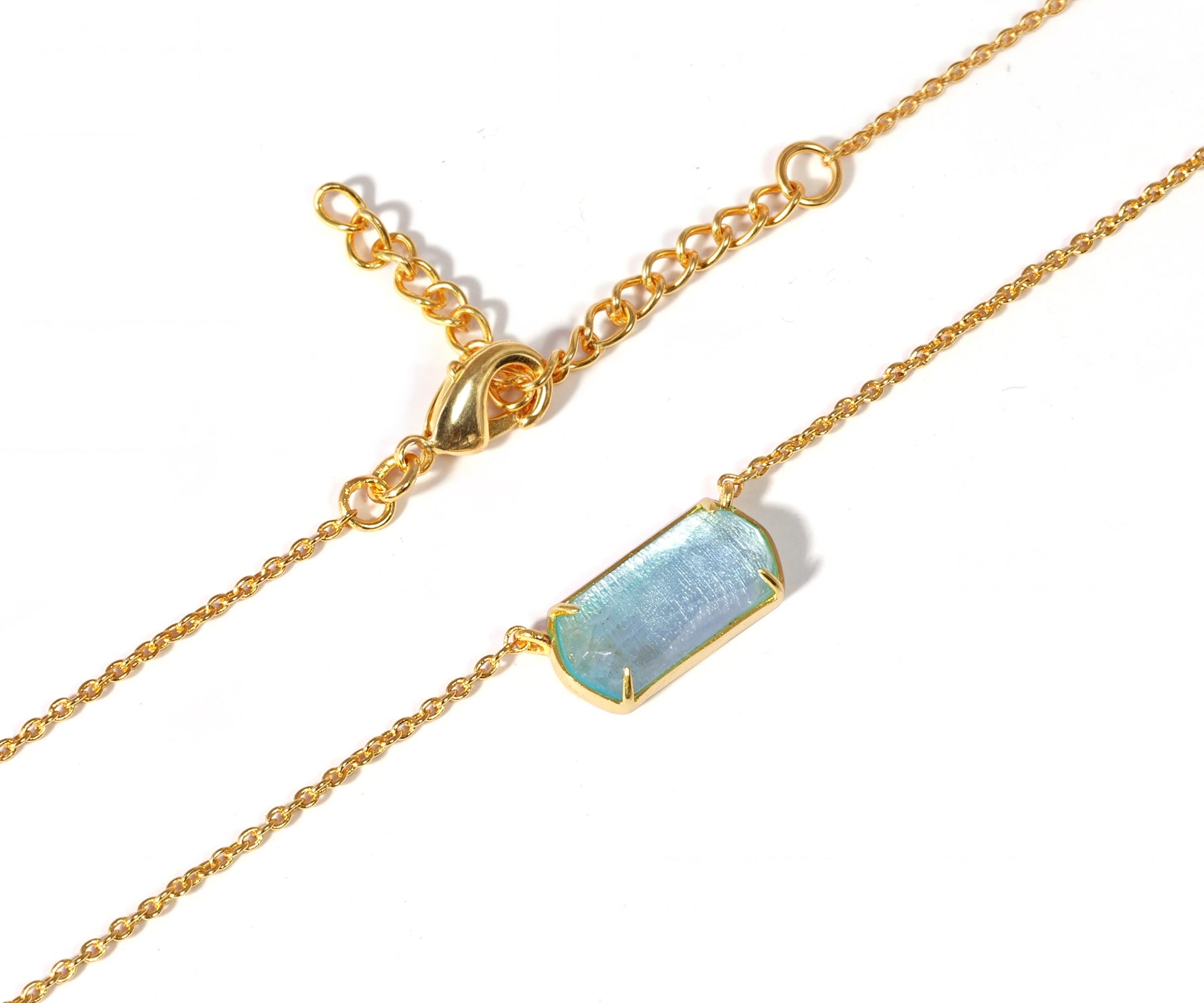 Gold plated chain necklace with a blue pendant. Gold plated chain necklace with a blue pendant.