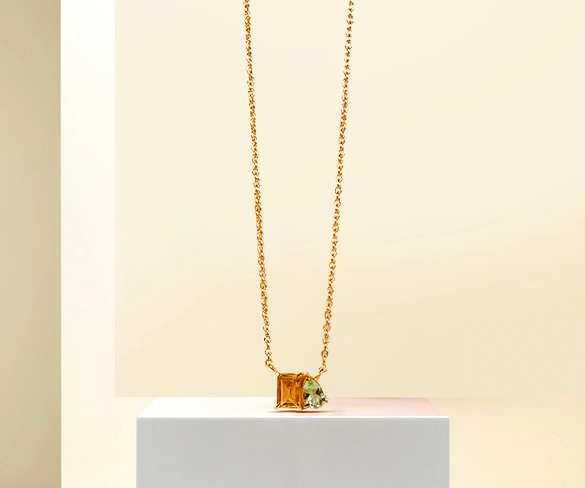 Green amethyst and citrine pendant necklace on gold chain. Green amethyst and citrine pendant necklace on gold chain.