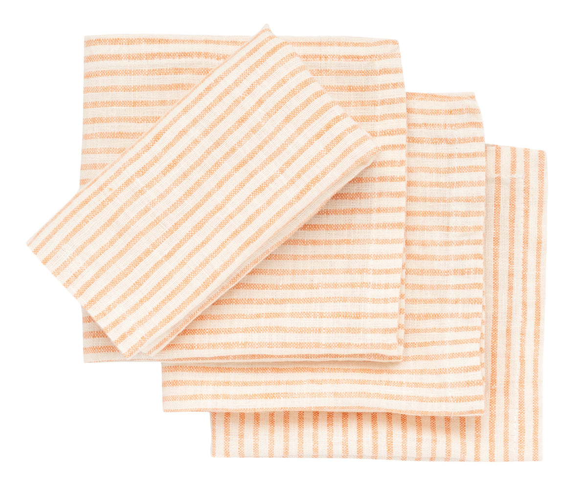 Set of striped napkins in peach and white on a white background Set of striped napkins in peach and white on a white background