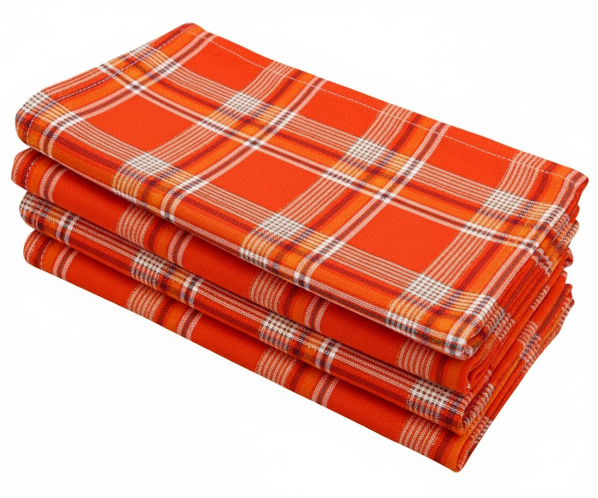 Add a cozy, rustic touch to your dining setup with tartan plaid cotton napkins in orange, red, white, and black checks. Add a cozy, rustic touch to your dining setup with tartan plaid cotton napkins in orange, red, white, and black checks.