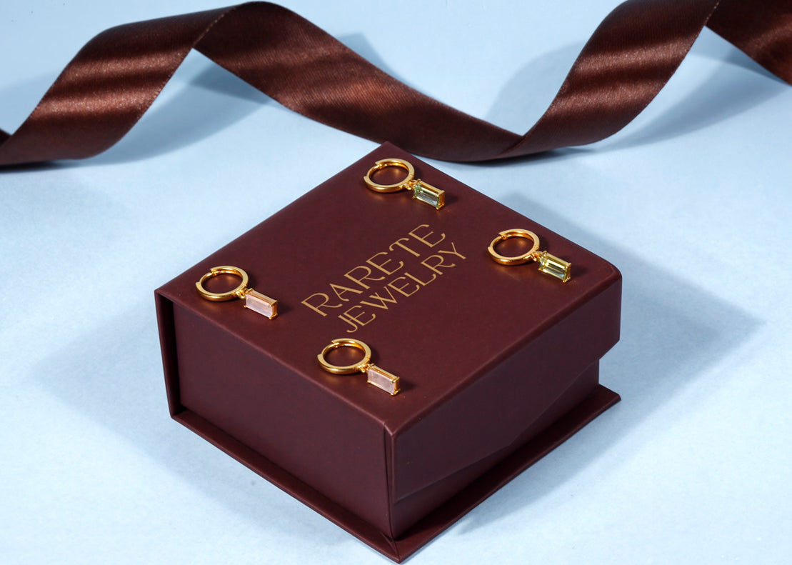 Modern huggie earrings with sleek stone detailing Modern huggie earrings with sleek stone detailing