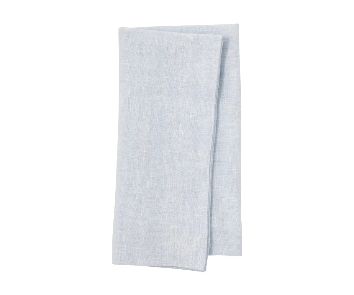 Pale blue linen napkins styled for a beachside brunch Pale blue linen napkins styled for a beachside brunch
