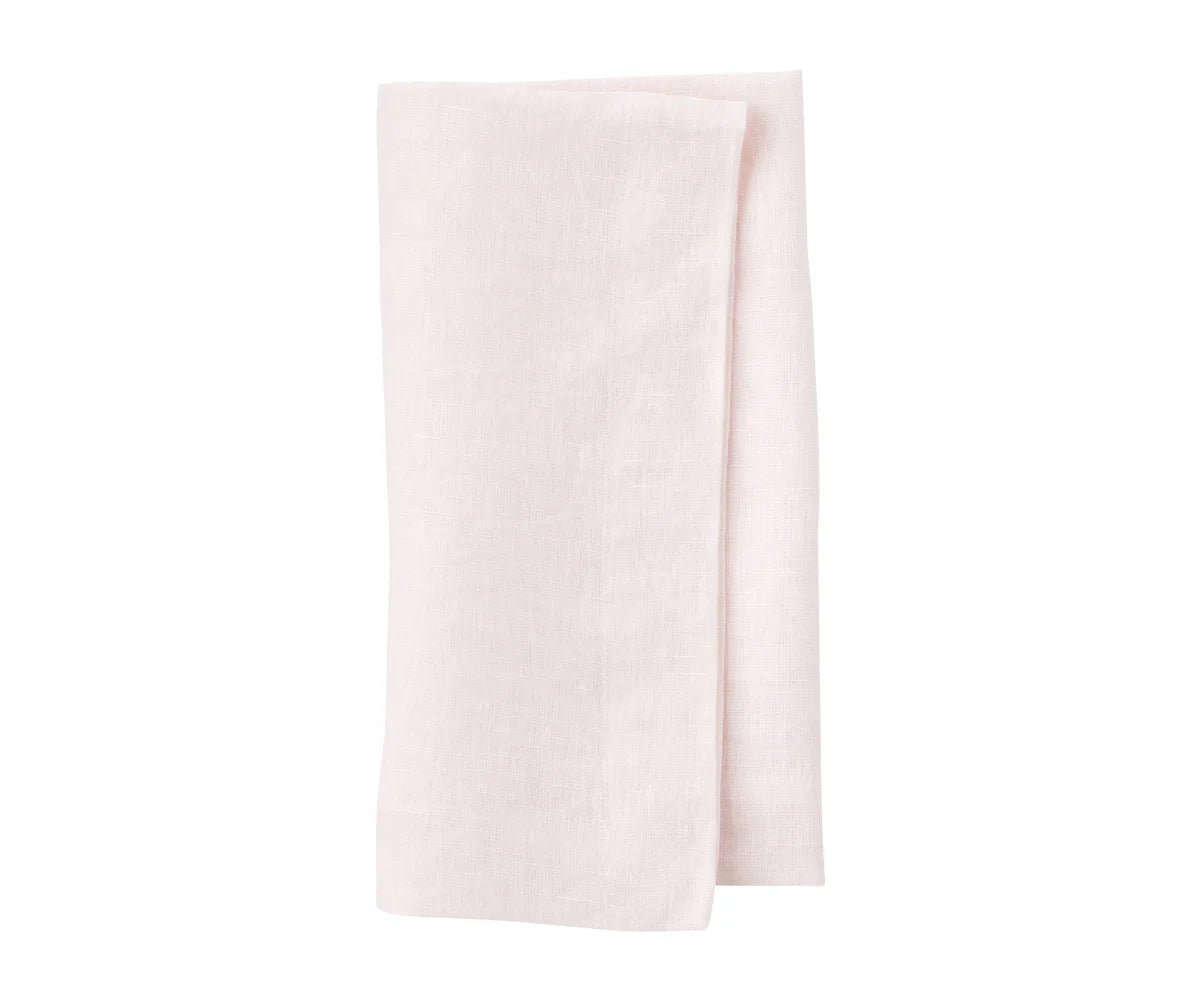 Neatly ironed linen napkins arranged with cutlery Neatly ironed linen napkins arranged with cutlery