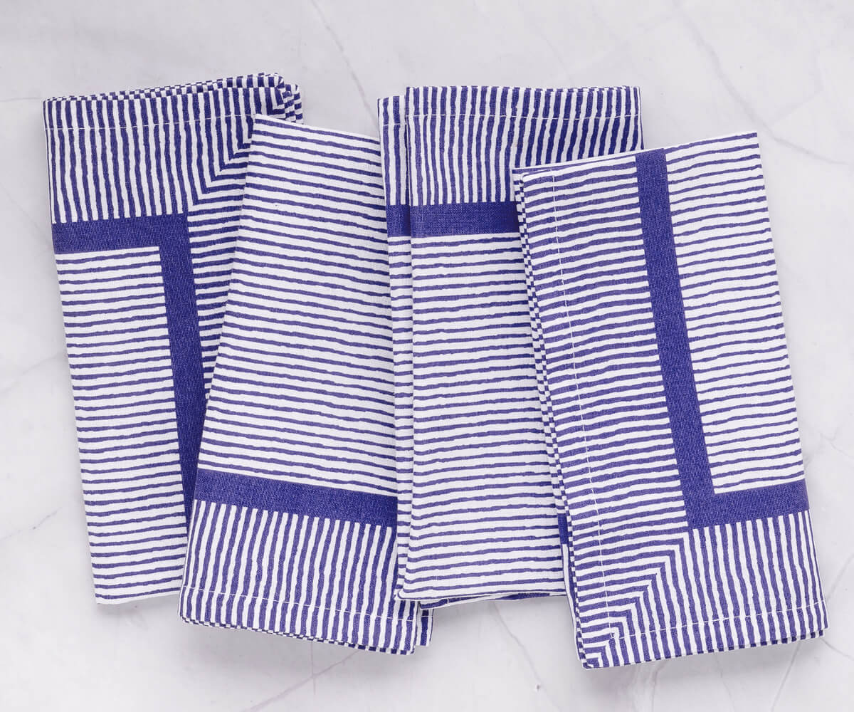 Blue striped napkins are versatile and can be paired with a variety of tableware Blue striped napkins are versatile and can be paired with a variety of tableware