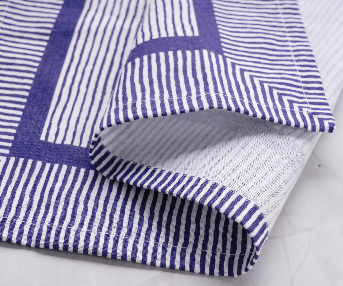 Blue striped napkins evoke a sense of nautical charm, reminiscent of the ocean and seaside vacations. Blue striped napkins evoke a sense of nautical charm, reminiscent of the ocean and seaside vacations.