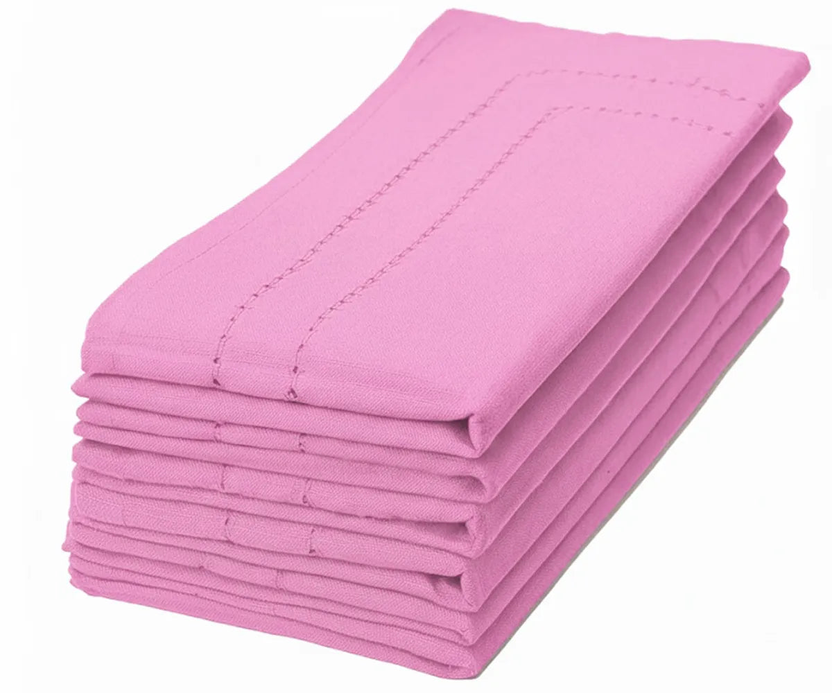 Pink cotton dinner napkin with a refined double hemstitch border, styled for elegant table settings. Pink cotton dinner napkin with a refined double hemstitch border, styled for elegant table settings.