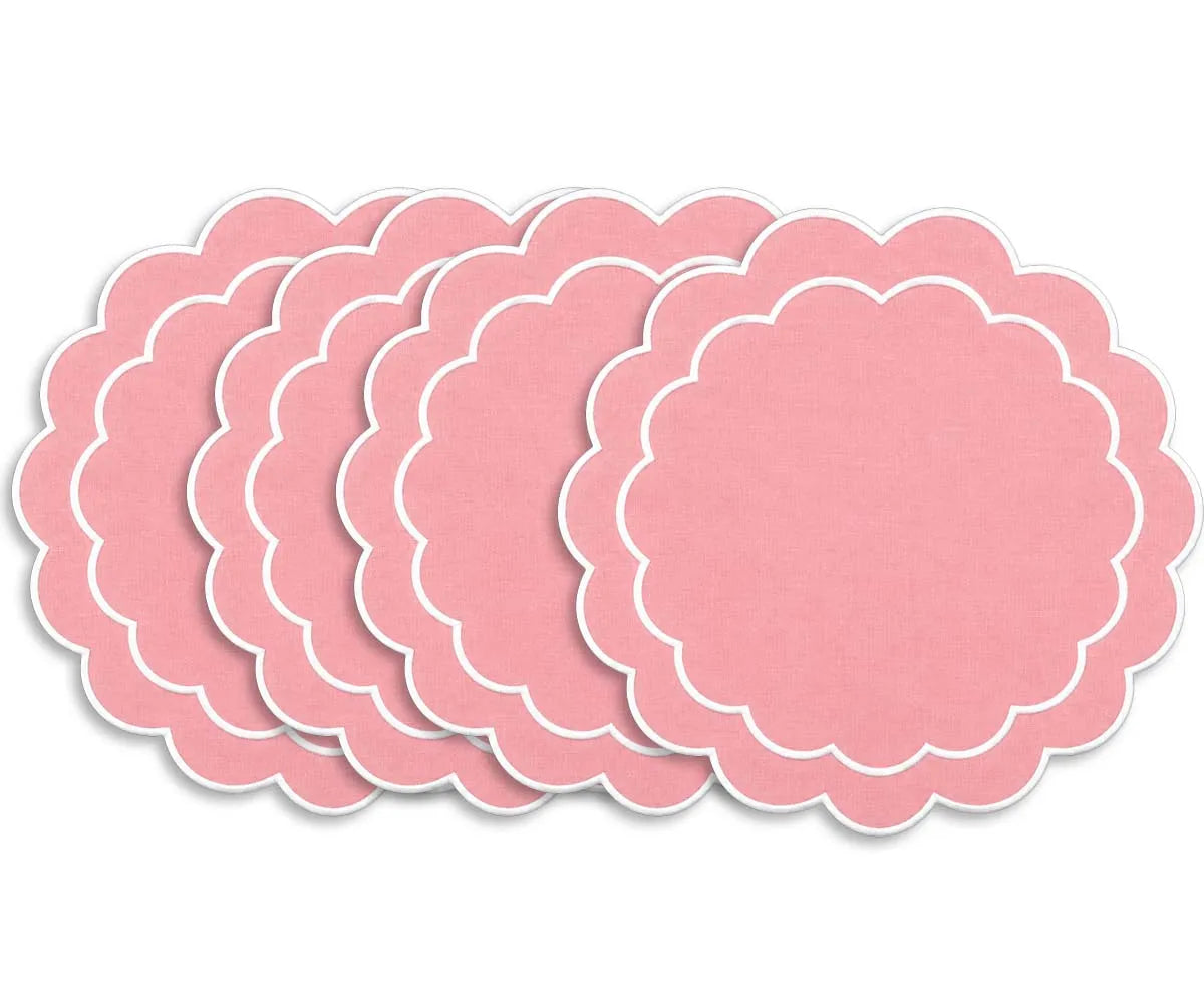 Round embroidered cotton placemat with scalloped detailing, designed to complement coordinated dining table arrangements Round embroidered cotton placemat with scalloped detailing, designed to complement coordinated dining table arrangements
