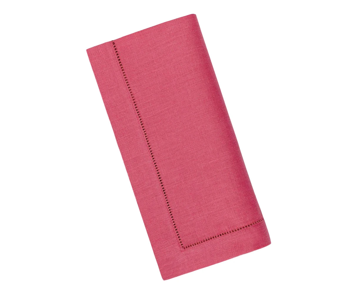 Table setting with blush pink linen napkins folded neatly beside dinnerware, highlighting hemstitch detail and premium linen texture.
 Table setting with blush pink linen napkins folded neatly beside dinnerware, highlighting hemstitch detail and premium linen texture.