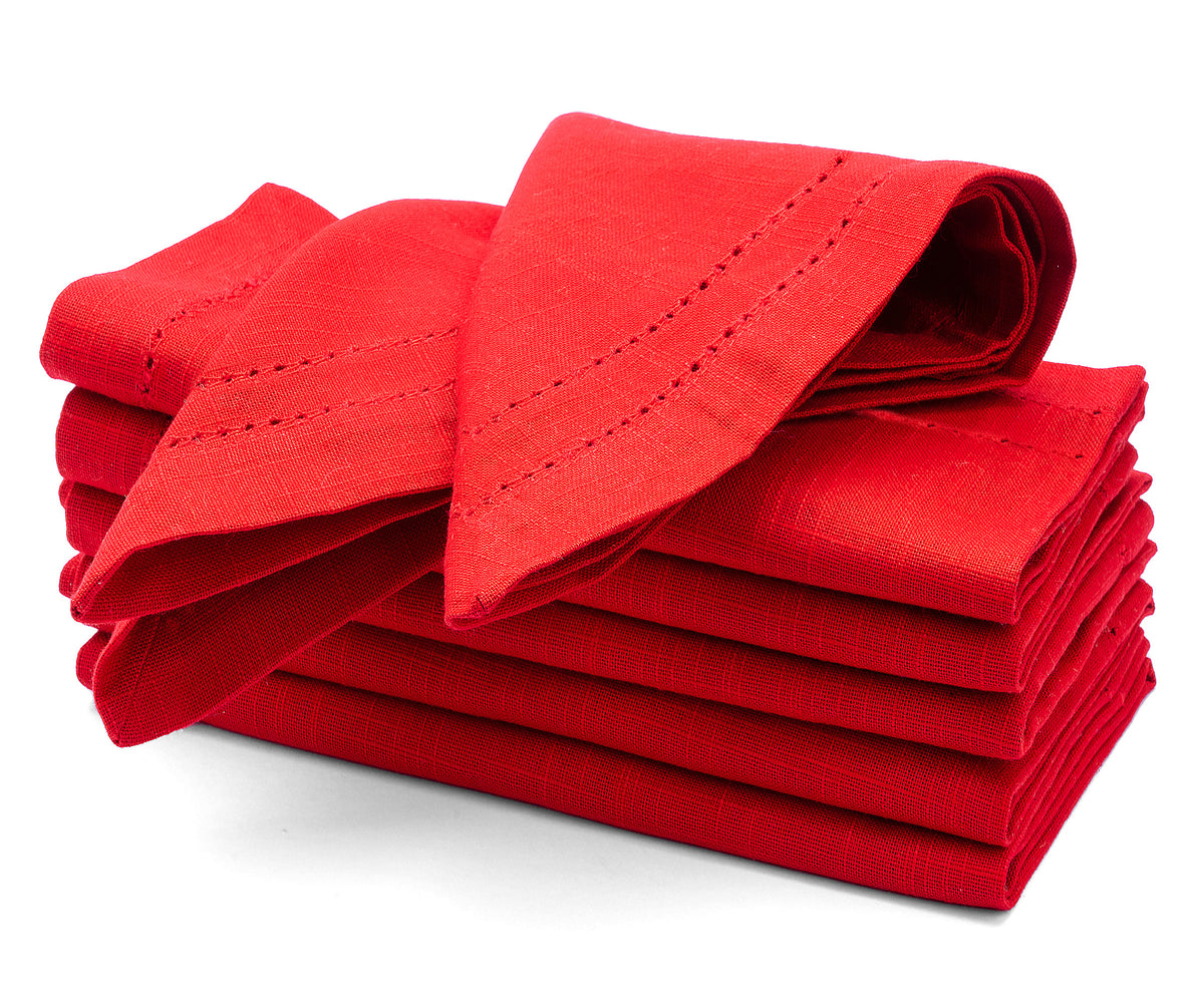 Stack of red folded napkins on a white background Stack of red folded napkins on a white background