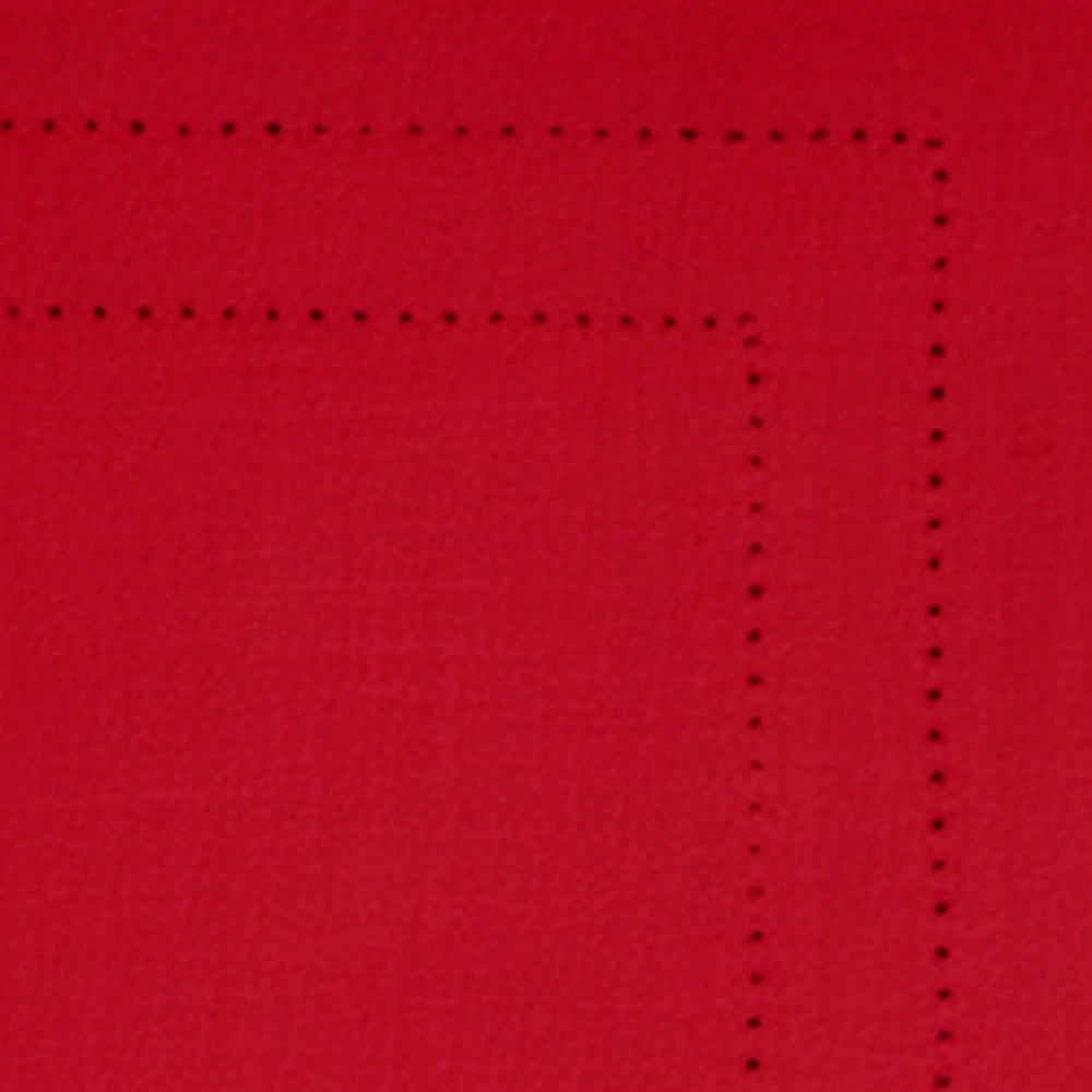 Festive table setup with red cotton hemstitch placemats for holiday dining Festive table setup with red cotton hemstitch placemats for holiday dining