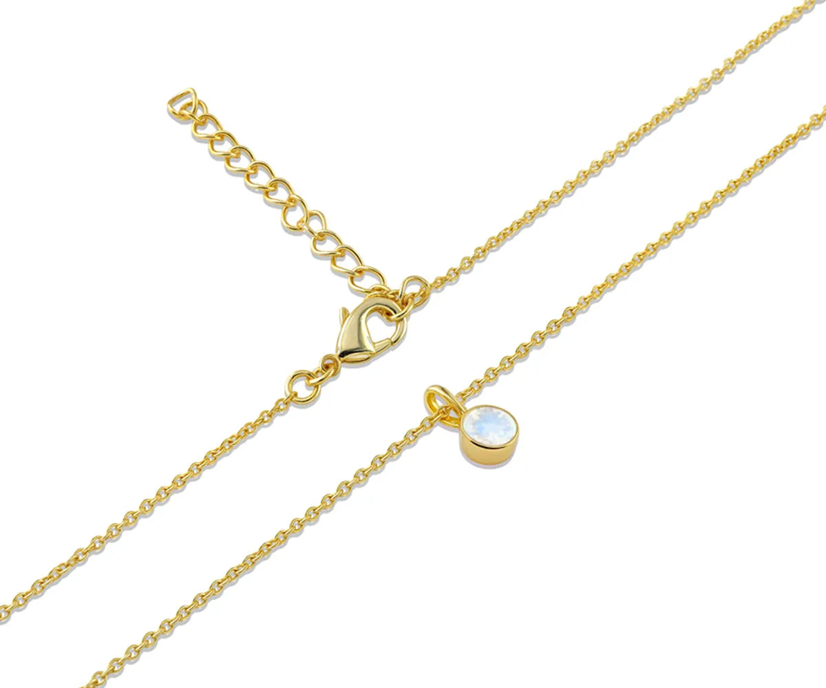 Close-up of 5mm brilliant-cut moonstone in gold setting Close-up of 5mm brilliant-cut moonstone in gold setting