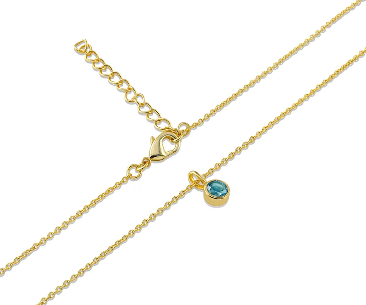 Close-up of Blue Topaz Birthstone Necklace in 14K Yellow Gold Plating Close-up of Blue Topaz Birthstone Necklace in 14K Yellow Gold Plating
