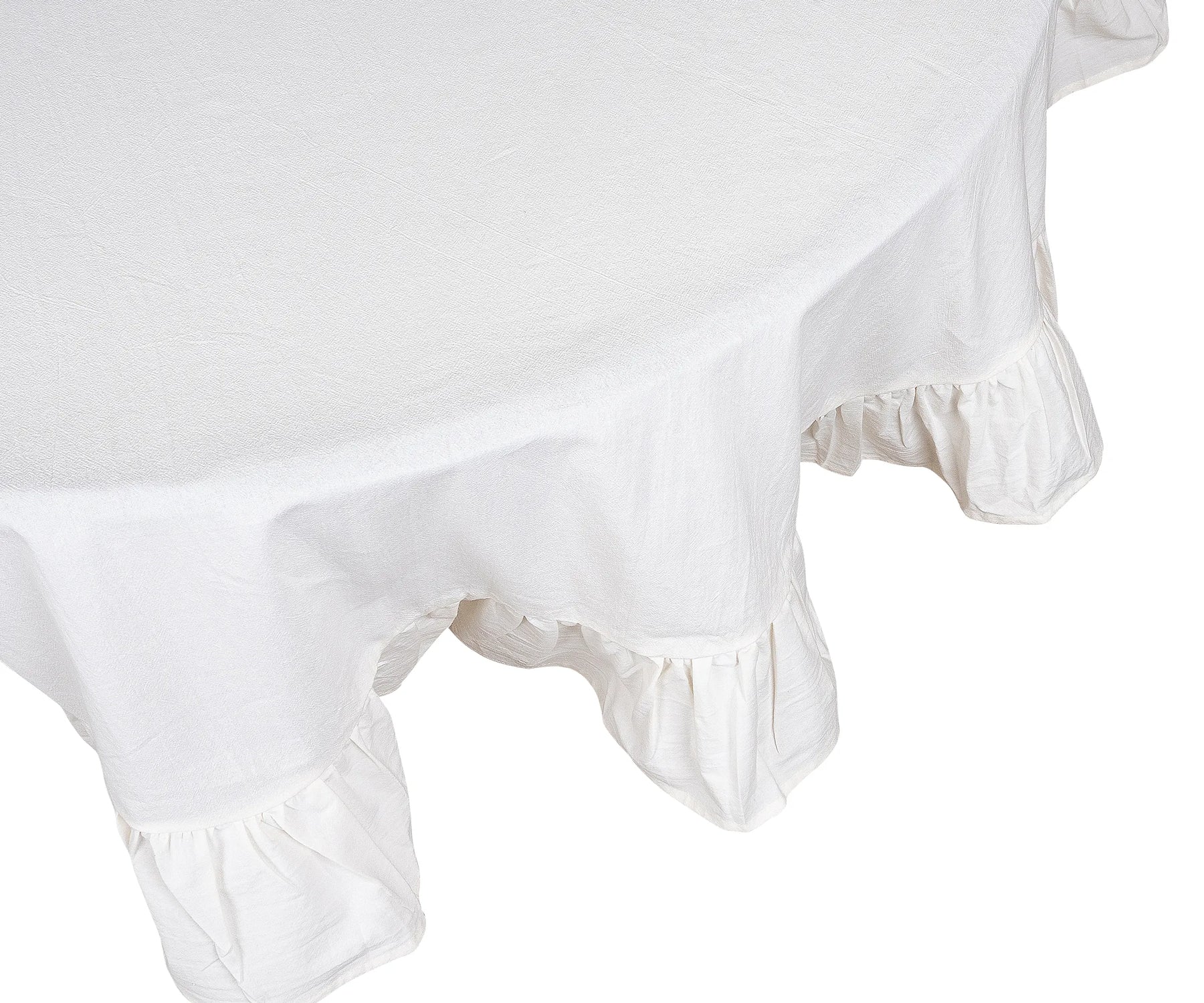 Cozy layered table setting with embroidered napkins and ruffled tablecloth Cozy layered table setting with embroidered napkins and ruffled tablecloth