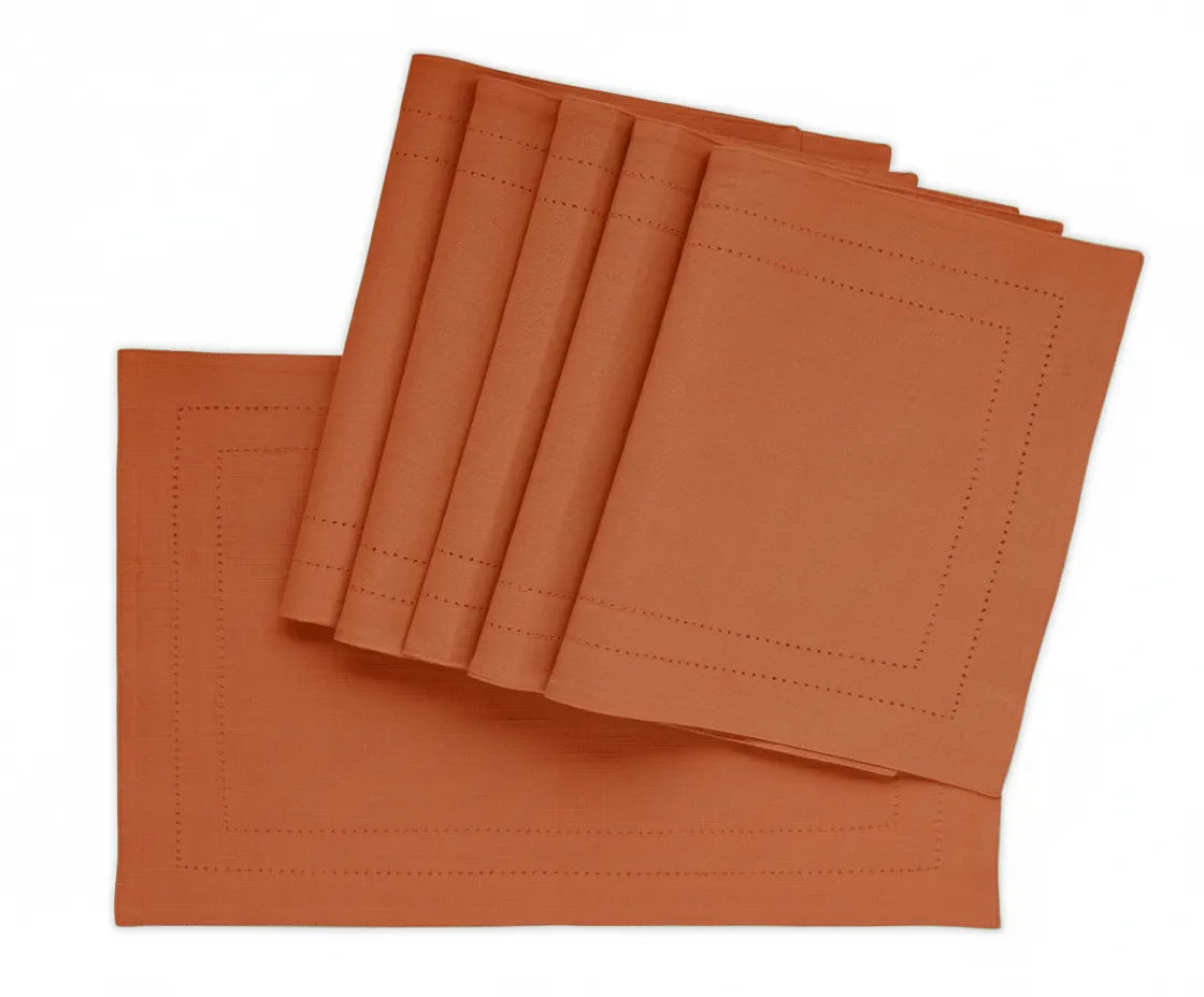 Rust double hemstitch cotton placemats on dining table – 13x18 inch rectangular set Rust double hemstitch cotton placemats on dining table – 13x18 inch rectangular set