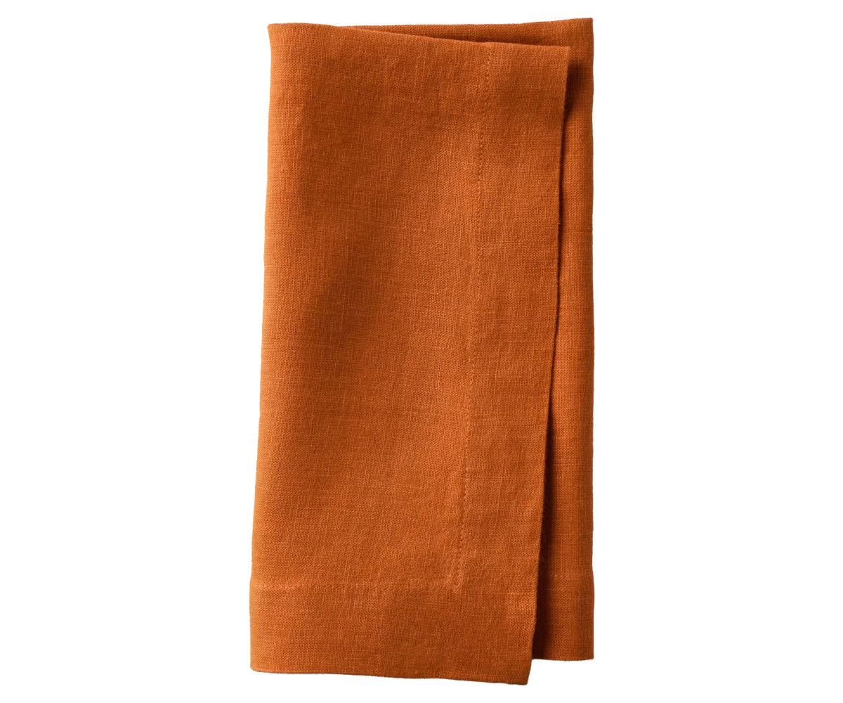 Napkins with mitered corners placed for a dinner party Napkins with mitered corners placed for a dinner party