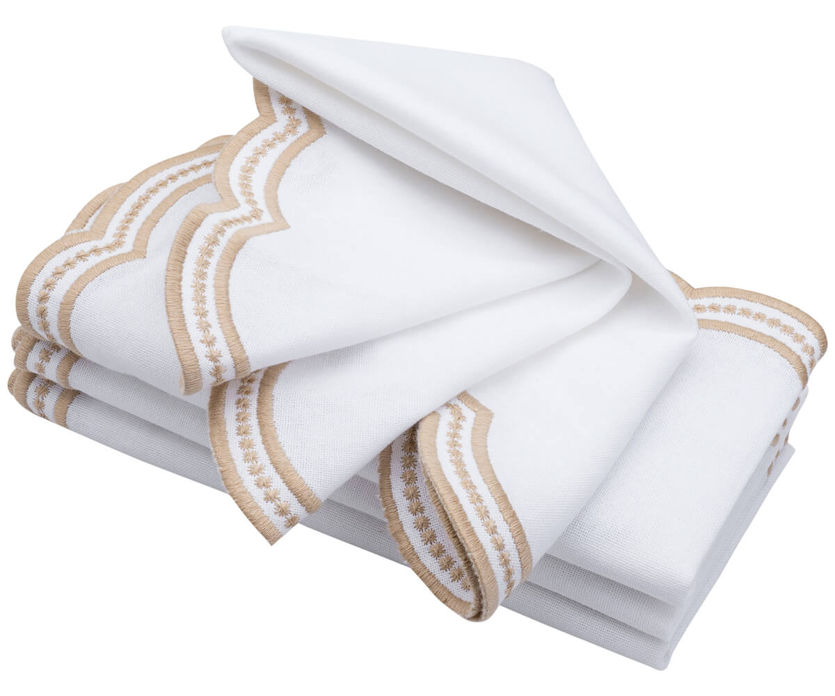 Beige scallop napkins displayed in a cozy, farmhouse-style kitchen Beige scallop napkins displayed in a cozy, farmhouse-style kitchen