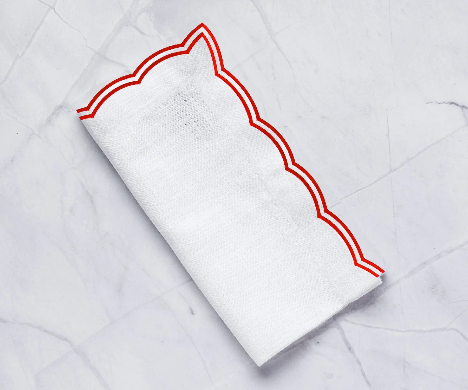 Set of red cotton napkins with scalloped edges perfect for parties or dinners Set of red cotton napkins with scalloped edges perfect for parties or dinners
