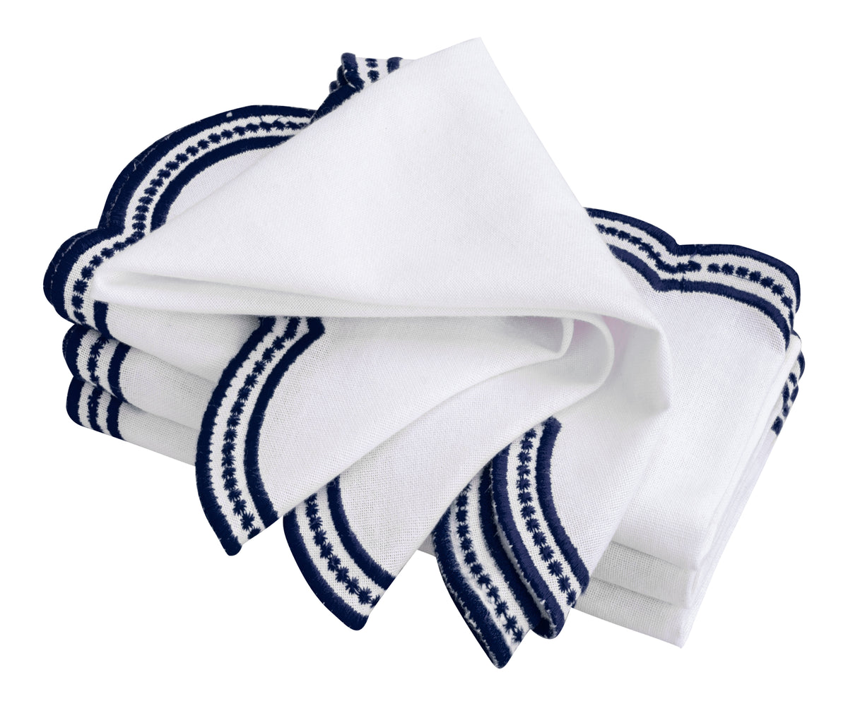 White and navy blue embroidered napkins with a classic scalloped design, ideal for home and restaurant use. White and navy blue embroidered napkins with a classic scalloped design, ideal for home and restaurant use.