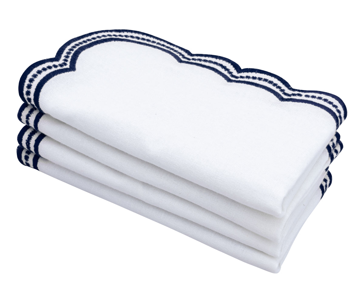 Elegant white napkins with navy blue scalloped embroidery, perfect for dining and special occasions. Elegant white napkins with navy blue scalloped embroidery, perfect for dining and special occasions.