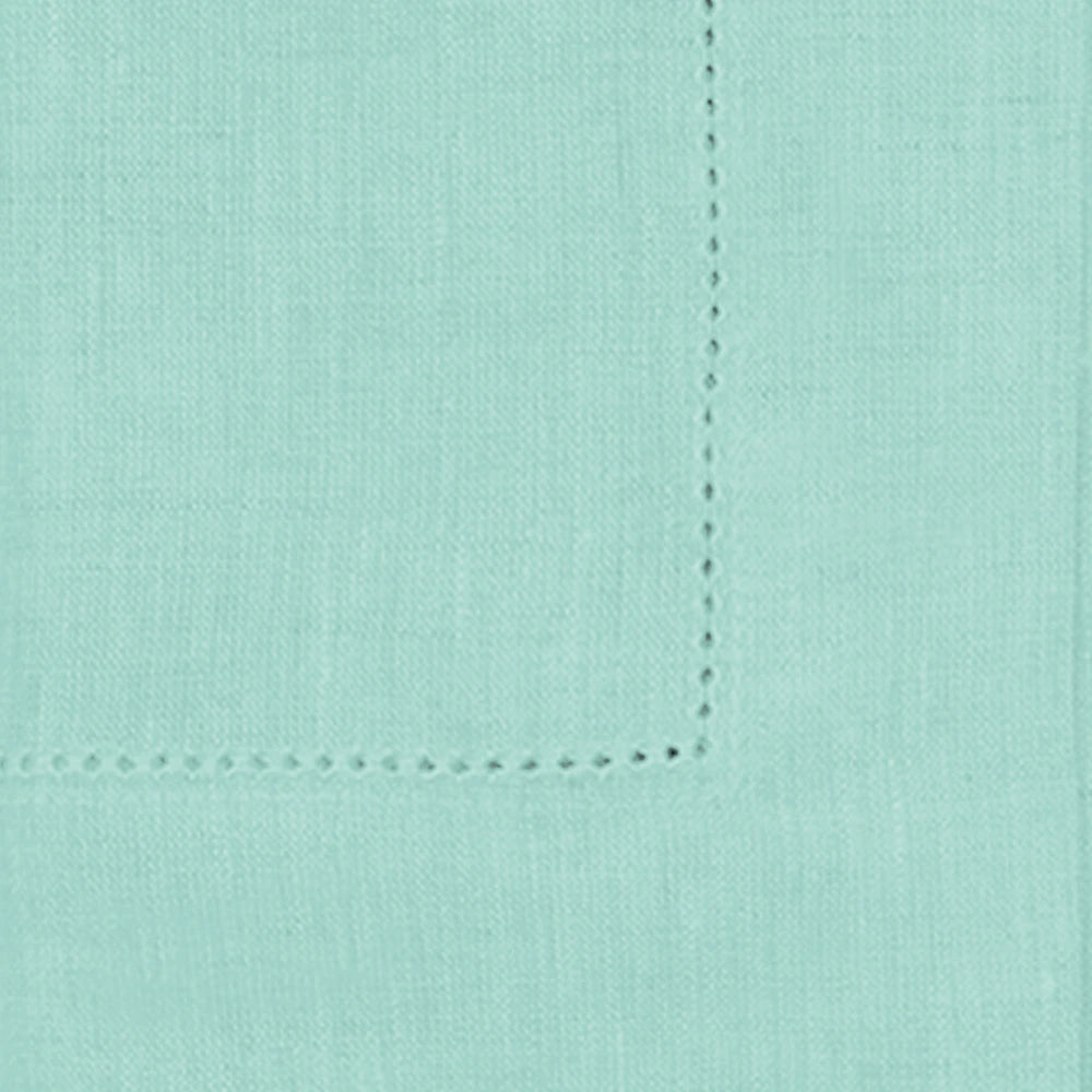 Seafoam green linen napkins styled on a modern dining table, adding a fresh and refined look to the table setting.
 Seafoam green linen napkins styled on a modern dining table, adding a fresh and refined look to the table setting.