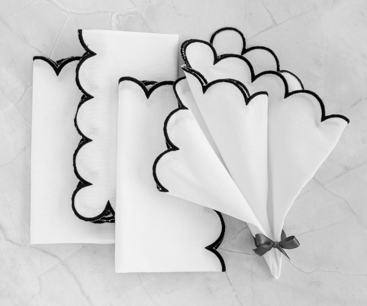 scalloped linen napkins add a touch of elegance and sophistication to any table setting. scalloped linen napkins add a touch of elegance and sophistication to any table setting.