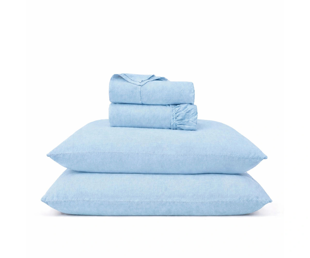 Light sky blue linen bed sheets with soft washed finish, natural linen sheet set for a relaxed bedroom look Light sky blue linen bed sheets with soft washed finish, natural linen sheet set for a relaxed bedroom look