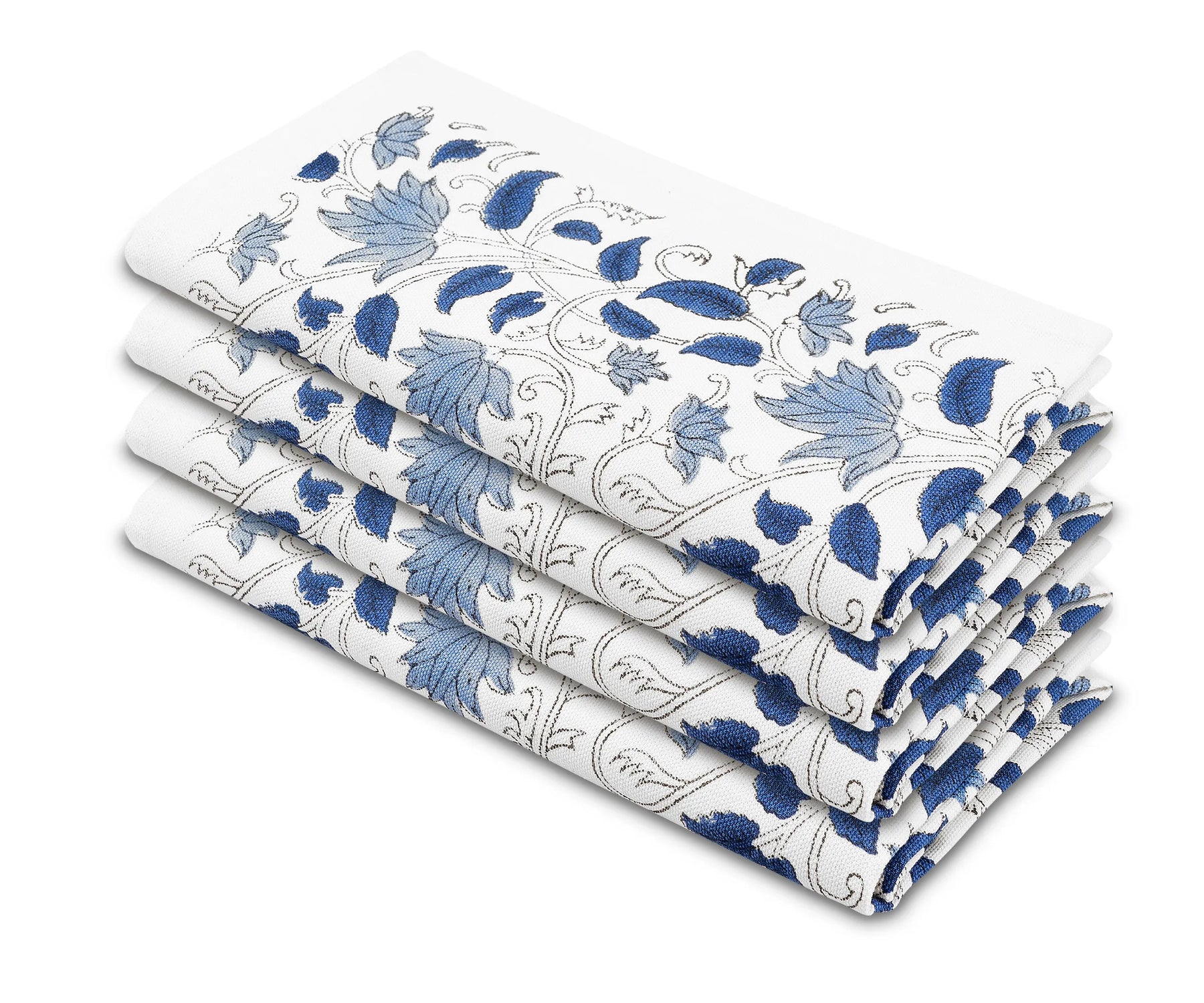 Blue block-printed cotton napkins styled with matching floral tablecloth Blue block-printed cotton napkins styled with matching floral tablecloth