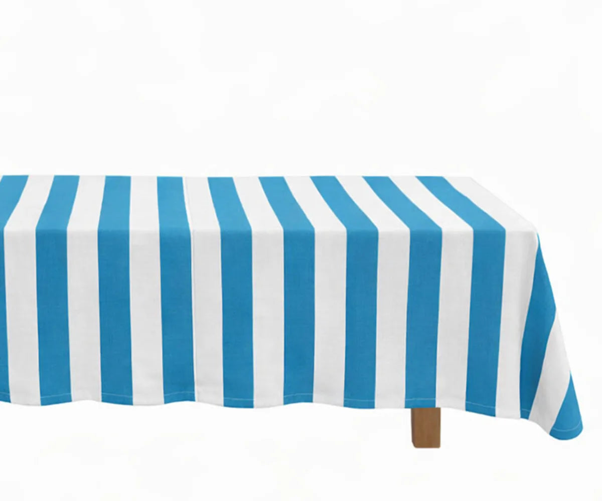 Rectangle cotton linen tablecloth with cabana stripe pattern styled on a dining table with a clean, tailored finish Rectangle cotton linen tablecloth with cabana stripe pattern styled on a dining table with a clean, tailored finish