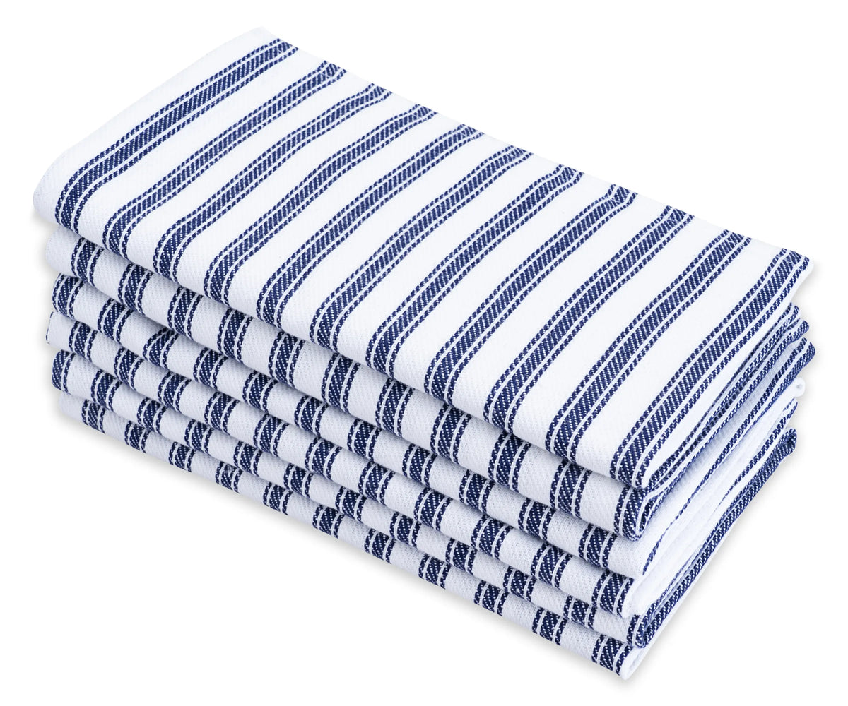Navy and white vertical striped cotton napkins set on a coastal-themed dining table Navy and white vertical striped cotton napkins set on a coastal-themed dining table