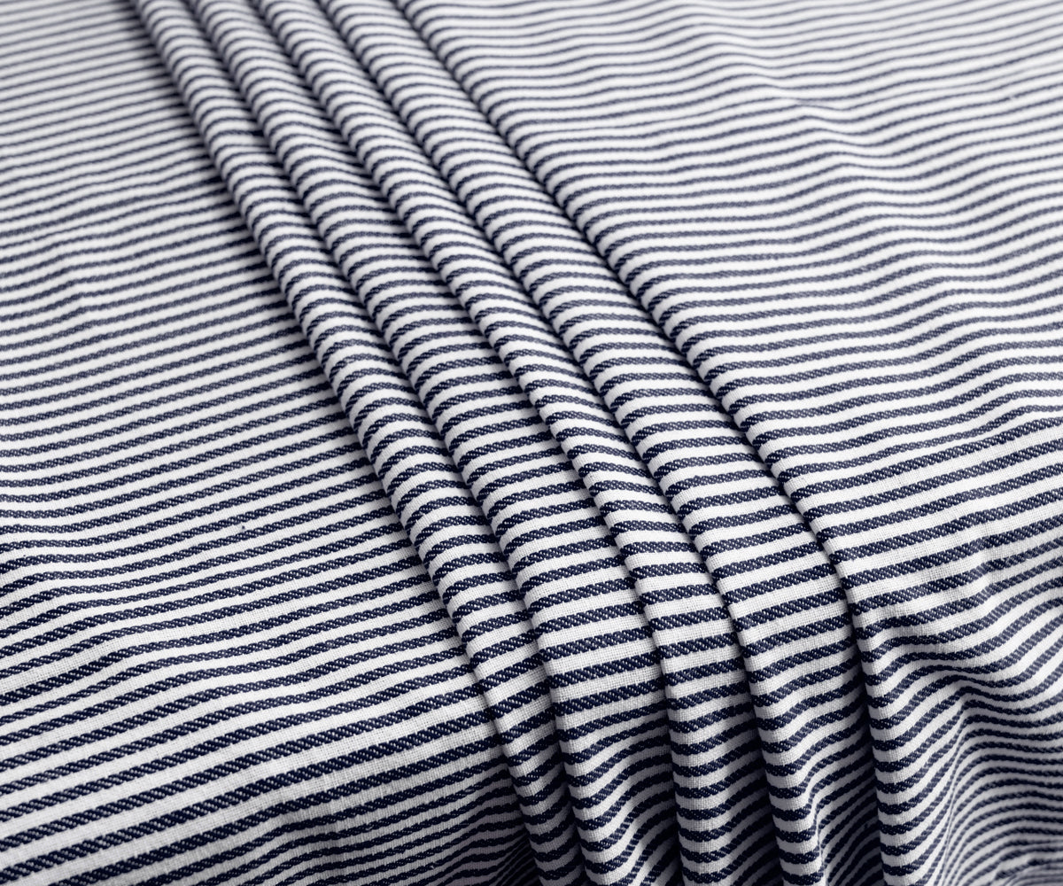 Navy tablecloth featuring vibrant red color stripes, perfect for a bold dining room statement. Navy tablecloth featuring vibrant red color stripes, perfect for a bold dining room statement.