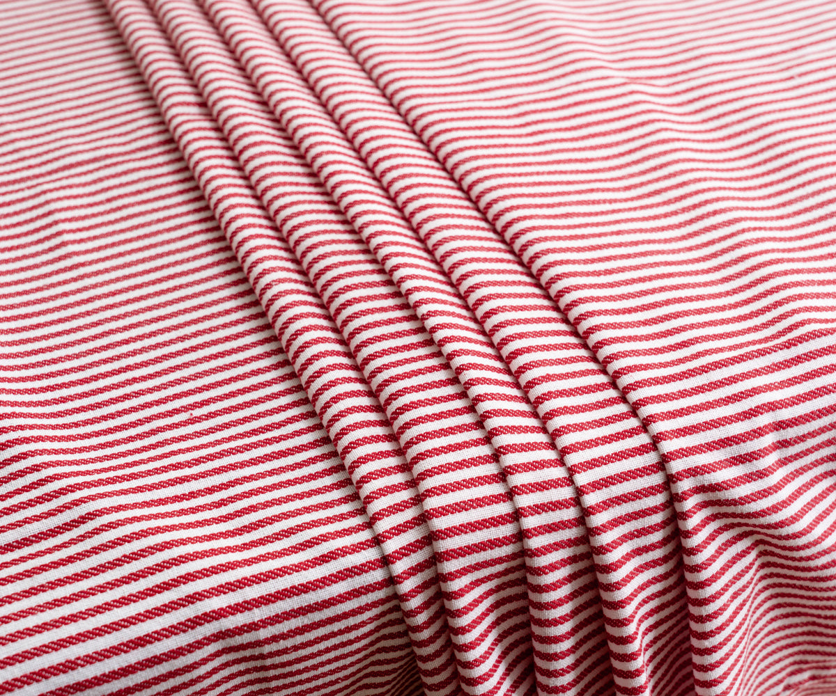 Red table cloth with a classic pattern and border, adding elegance to your dining area. Red table cloth with a classic pattern and border, adding elegance to your dining area.
