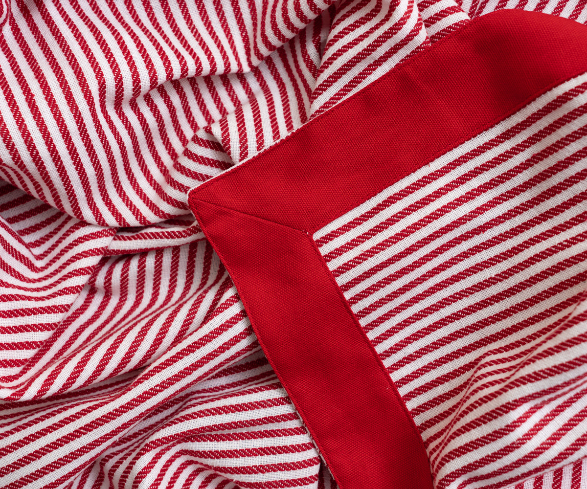 Red table cloth featuring modern design elements, adding flair to your dining room. Red table cloth featuring modern design elements, adding flair to your dining room.