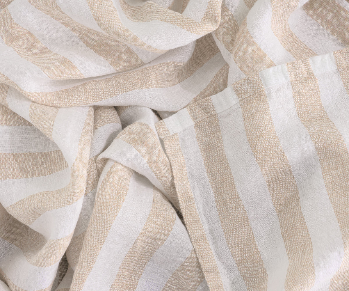 Extra-large beige table cloth for spacious dining setups. Extra-large beige table cloth for spacious dining setups.