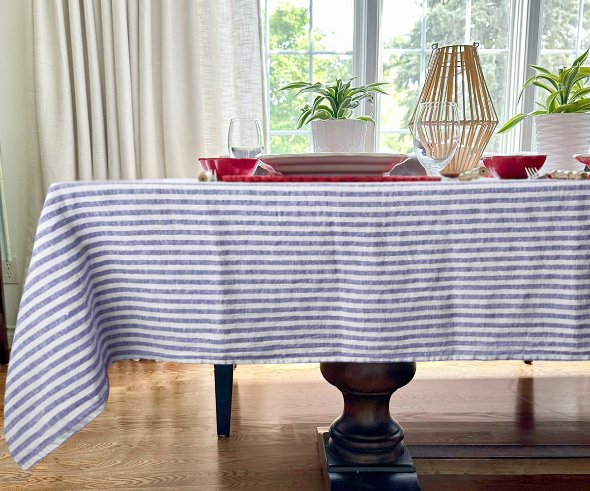 A refined blue and white linen tablecloth for sophisticated gatherings. A refined blue and white linen tablecloth for sophisticated gatherings.