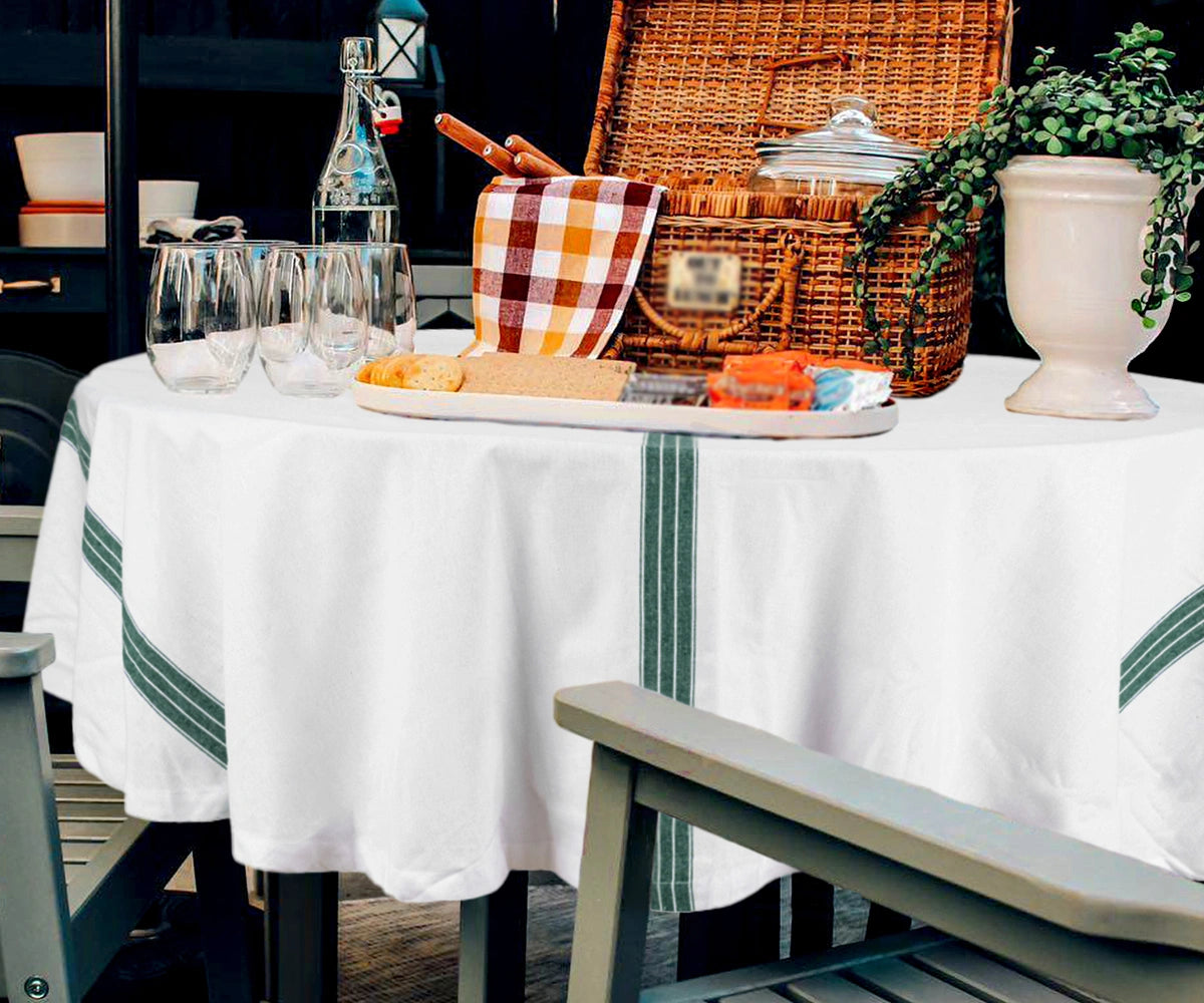 White round cotton tablecloth on dining table White round cotton tablecloth on dining table