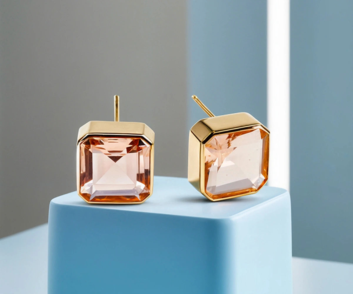 Close-up of blush morganite studs highlighting the Asscher cut and brilliant facets. Close-up of blush morganite studs highlighting the Asscher cut and brilliant facets.