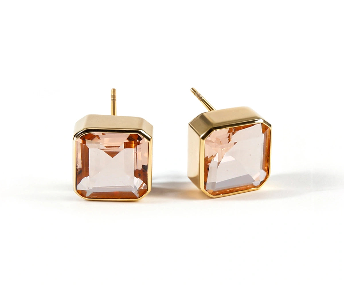 Soft pink blush morganite stud earrings with a 10mm Asscher-cut stone set in 18K gold-plated brass. Soft pink blush morganite stud earrings with a 10mm Asscher-cut stone set in 18K gold-plated brass.