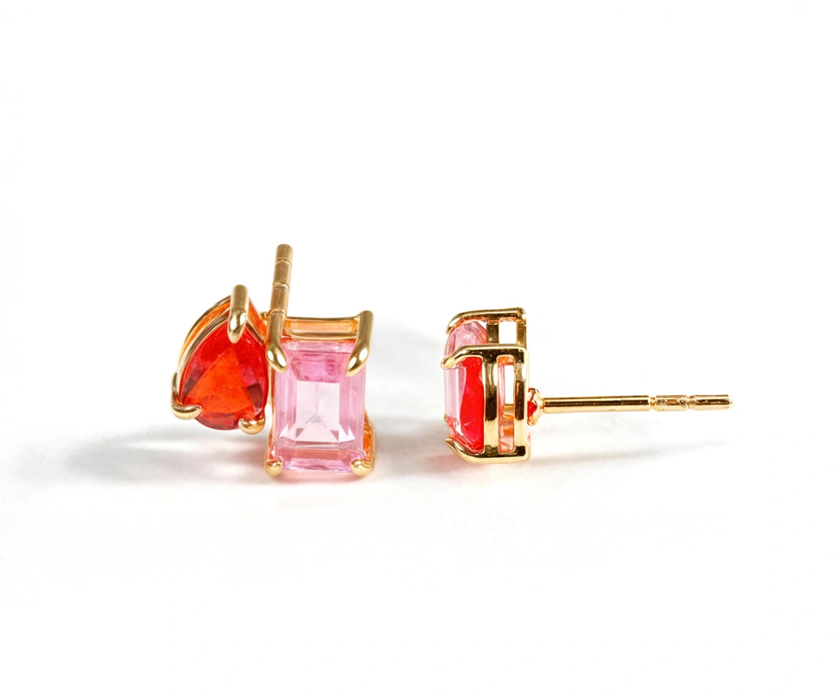 Toi et Moi ruby stud earrings with emerald-cut and pear-cut stones set in 18K yellow gold-plated brass Toi et Moi ruby stud earrings with emerald-cut and pear-cut stones set in 18K yellow gold-plated brass