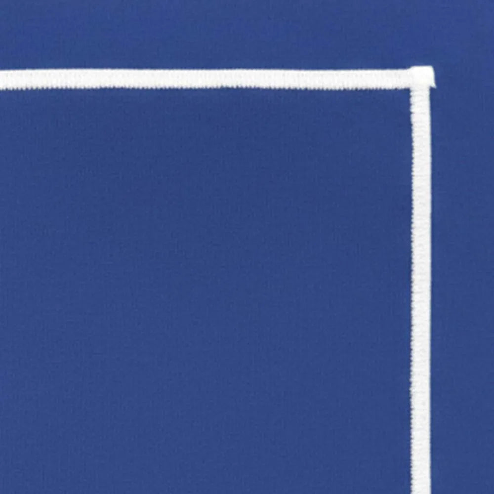 Close-up of white embroidery detail on blue cotton rectangular tablecloth for wedding and formal table setting. Close-up of white embroidery detail on blue cotton rectangular tablecloth for wedding and formal table setting.