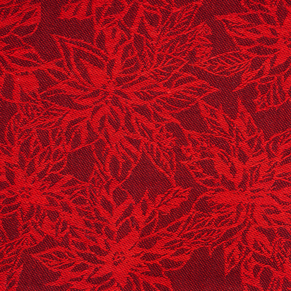 Red floral patterned fabric with intricate poinsettia-like designs. Red floral patterned fabric with intricate poinsettia-like designs.
