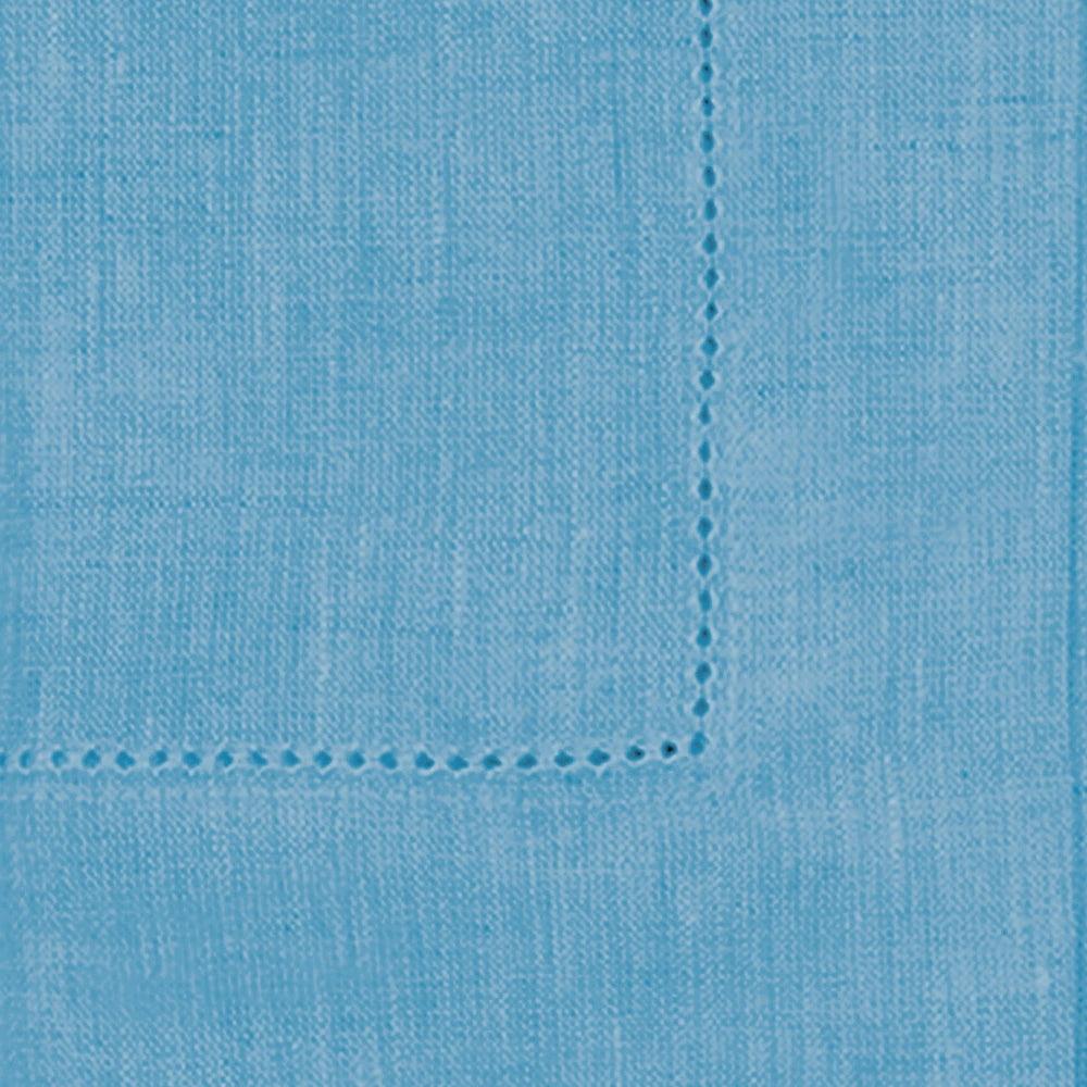 Set of teal cloth napkins in various sizes, styled with elegant tableware Set of teal cloth napkins in various sizes, styled with elegant tableware
