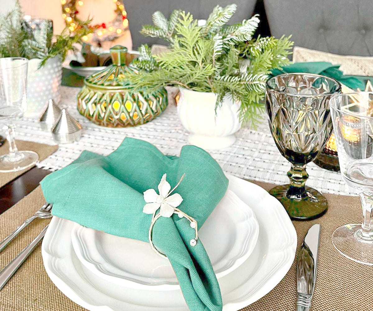 Upgrade your table decor with green fabric placemats, adding a touch of charm and protection, perfect for enjoyable dining moments.  Upgrade your table decor with green fabric placemats, adding a touch of charm and protection, perfect for enjoyable dining moments.