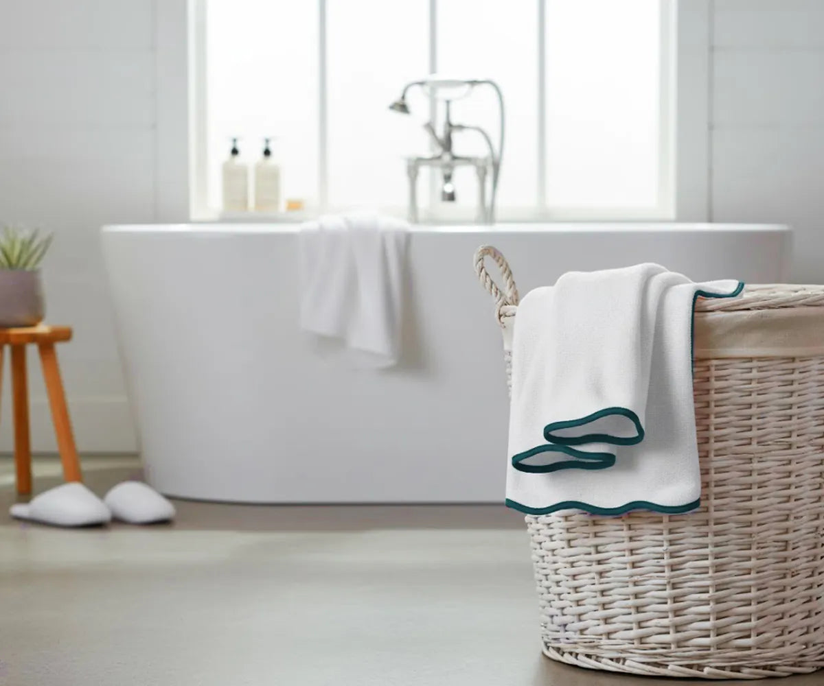 Close-up of green and white bath towel highlighting plush cotton weave and absorbency Close-up of green and white bath towel highlighting plush cotton weave and absorbency