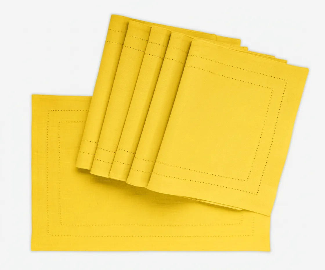 Yellow double hemstitched cotton rectangle placemat on dining table – 13x18 inches Yellow double hemstitched cotton rectangle placemat on dining table – 13x18 inches