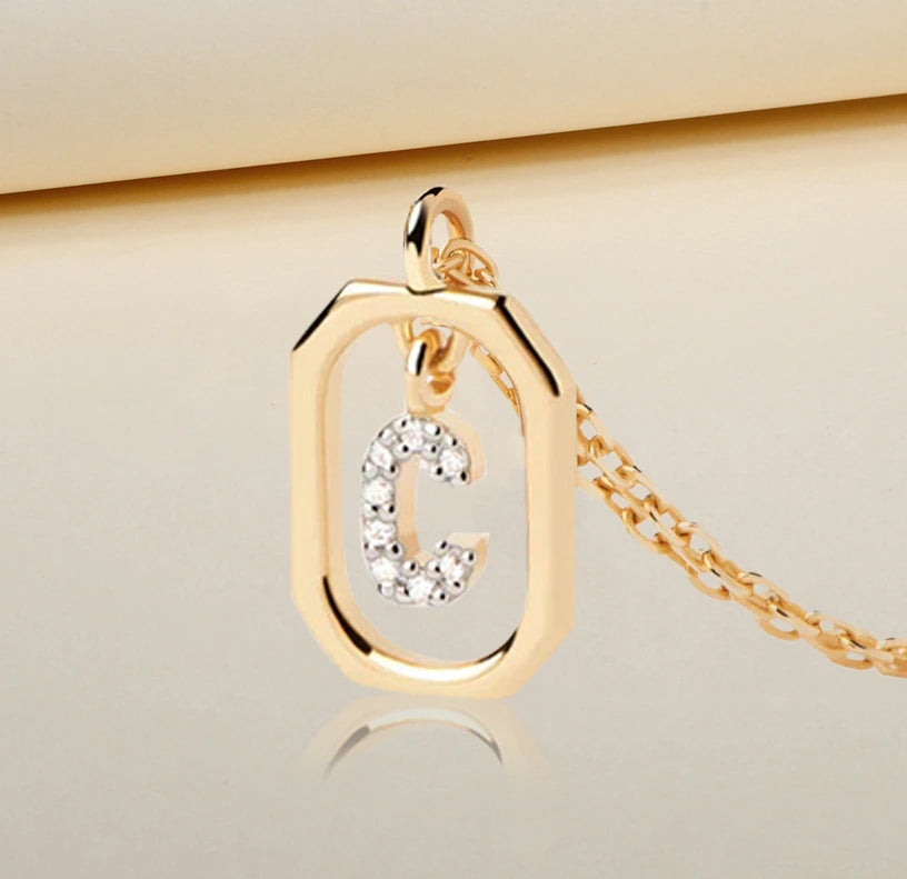 Elegant gold C pendant necklace with sparkling zircon stones Elegant gold C pendant necklace with sparkling zircon stones