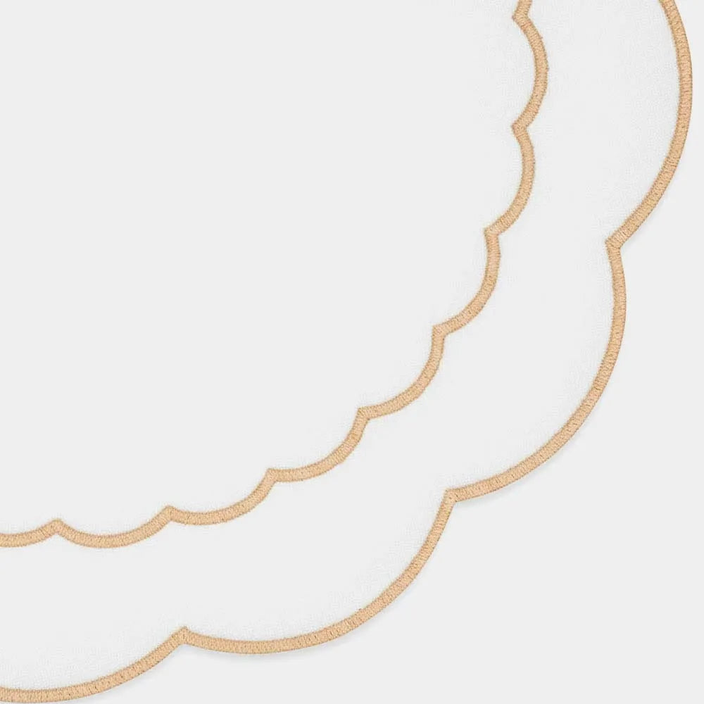 Round beige cotton placemat featuring scalloped edging and delicate embroidered peony accents Round beige cotton placemat featuring scalloped edging and delicate embroidered peony accents