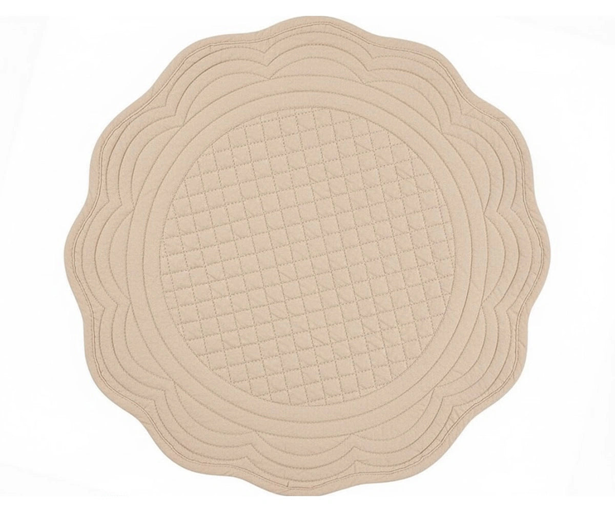 Beige quilted cotton round placemat with scalloped edge for neutral farmhouse and minimalist table décor Beige quilted cotton round placemat with scalloped edge for neutral farmhouse and minimalist table décor
