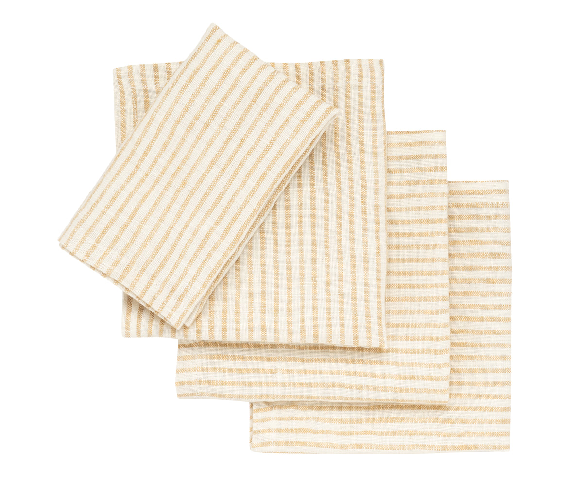 Natural-toned linen napkins rolled with twine for rustic wedding table décor Natural-toned linen napkins rolled with twine for rustic wedding table décor